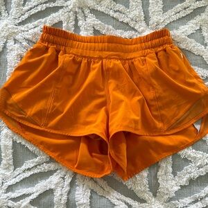 Orange lululemon running shorts